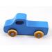Handmade wooden toy pickup truck painted in baby blue with metallic sapphire blue trim. The truck features non-marring amber shellac wheels and is part of my Play Pal Collection. A close-up shot of the toy truck on a white background. Made to Order.